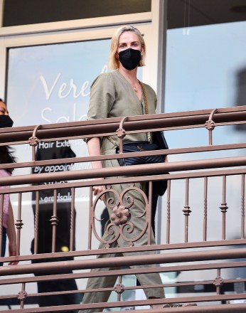 EXCLUSIVE: Charlize Theron in a khaki jumpsuit was spotted arriving with her and her best friend at an upscale Sushi Park restaurant to celebrate her daughter Jackson's birthday. June 2021 15th Photo: Charlize Theron. Photo credit: MEGA TheMegaAgency.com +1 888 505 6342 (Mega Agency TagID: MEGA762894_009.jpg) [Photo via Mega Agency]
