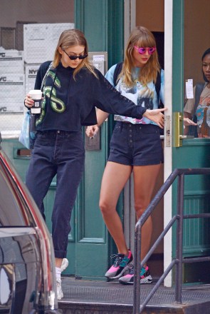 Taylor Swift and Gigi Hadid and friends Martha Hunt, Haim sisters (not pictured here) go on a girl's day out as they were  seen exiting Swift's Tribeca apartment in New York City. Swift wore her a shirt with her cats printed and also a skirt short.Pictured: Taylor Swift,Gigi HadidRef: SPL5009753 130718 NON-EXCLUSIVEPicture by: Edward Opi / SplashNews.comSplash News and PicturesLos Angeles: 310-821-2666New York: 212-619-2666London: 0207 644 7656Milan: +39 02 4399 8577Sydney: +61 02 9240 7700photodesk@splashnews.comWorld Rights, No Portugal Rights