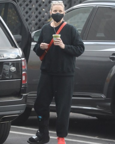 Beverly Hills, CA  - *EXCLUSIVE*  - Former actress Cameron Diaz seen stepping out to run some errands and sporting a walking boot.  It appears Cameron injured her foot or leg in some form, but looks to be taking it in stride.  Pictured: Cameron Diaz  BACKGRID USA 21 FEBRUARY 2022   BYLINE MUST READ: PrimePix / BACKGRID  USA: +1 310 798 9111 / usasales@backgrid.com  UK: +44 208 344 2007 / uksales@backgrid.com  *UK Clients - Pictures Containing Children Please Pixelate Face Prior To Publication*