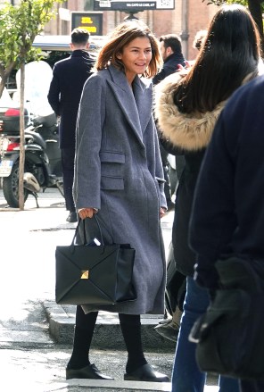 Rome, ITALY  - *EXCLUSIVE*  - Bulgari's global ambassador Zendaya is spotted leaving the Eden Hotel in Rome after three days of filming the new Bulgari advertisement. Zendaya used the back service door where she stopped to take a few selfies with her lucky fans. The actress went makeup free and sported a long coat and Valentino one stud Nappa handbag.Pictured: ZendayaBACKGRID USA 13 FEBRUARY 2023 BYLINE MUST READ: Cobra Team / BACKGRIDUSA: +1 310 798 9111 / usasales@backgrid.comUK: +44 208 344 2007 / uksales@backgrid.com*UK Clients - Pictures Containing ChildrenPlease Pixelate Face Prior To Publication*