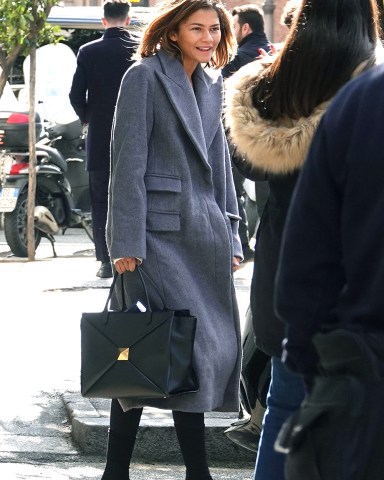 Rome, ITALY  - *EXCLUSIVE*  - Bulgari's global ambassador Zendaya is spotted leaving the Eden Hotel in Rome after three days of filming the new Bulgari advertisement. Zendaya used the back service door where she stopped to take a few selfies with her lucky fans. The actress went makeup free and sported a long coat and Valentino one stud Nappa handbag.Pictured: ZendayaBACKGRID USA 13 FEBRUARY 2023 BYLINE MUST READ: Cobra Team / BACKGRIDUSA: +1 310 798 9111 / usasales@backgrid.comUK: +44 208 344 2007 / uksales@backgrid.com*UK Clients - Pictures Containing ChildrenPlease Pixelate Face Prior To Publication*