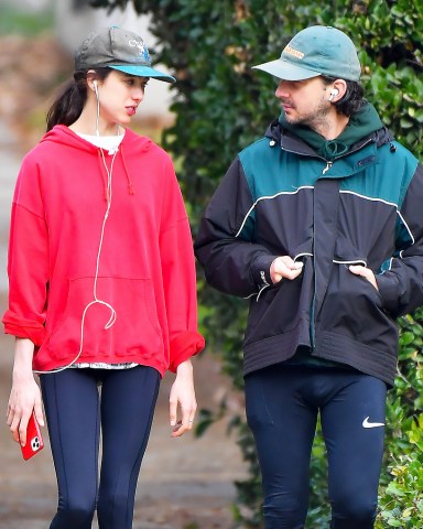 EXCLUSIVE: The couple that runs together! Shia LaBeouf and his girlfriend Margaret Qualley take early morning jog in his Pasadena neighborhood. The couple were seen taking a long jog in the early morning and kept their jackets on. 29 Dec 2020 Pictured: Shia LaBeouf and Margaret Qualley. Photo credit: Snorlax / MEGA TheMegaAgency.com +1 888 505 6342 (Mega Agency TagID: MEGA723471_001.jpg) [Photo via Mega Agency]