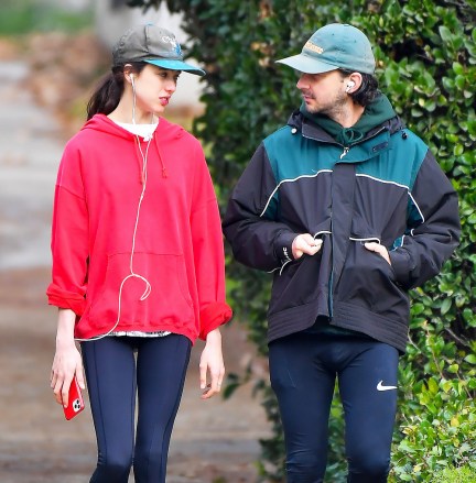 EXCLUSIVE: The couple that runs together!  Shia LaBeouf and his girlfriend Margaret Qualley go for an early morning run in their Pasadena neighborhood.  The pair were seen taking a long early morning jog without removing their jackets.  December 29, 2020 Pictured: Shia LaBeouf and Margaret Qualley.  Photo Credit: Snorlax / MEGA TheMegaAgency.com +1 888 505 6342 (Mega Agency TagID: MEGA723471_001.jpg) [Photo via Mega Agency]