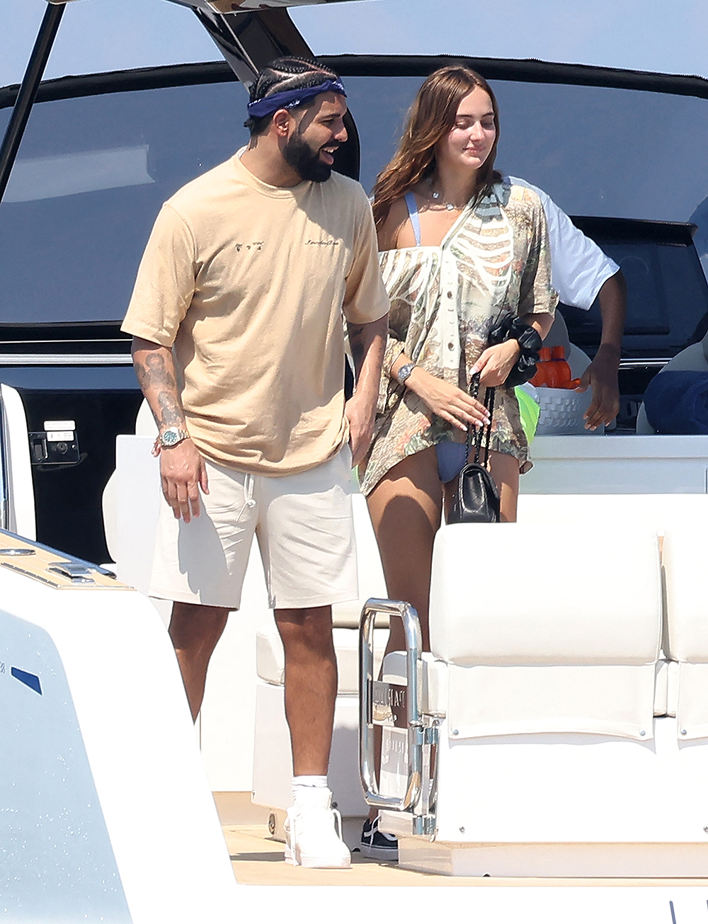 Saint-Tropez, FRANCE  - *EXCLUSIVE*  - Rapper Drake and a mystery woman arrive for lunch at Club 55 in Saint-Tropez while vacationing in the French Riviera.

Pictured: Drake

BACKGRID USA 19 JULY 2022 

BYLINE MUST READ: ELIOT / MEGA - BEST IMAGE / BACKGRID

USA: +1 310 798 9111 / usasales@backgrid.com

UK: +44 208 344 2007 / uksales@backgrid.com

*UK Clients - Pictures Containing Children
Please Pixelate Face Prior To Publication*