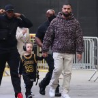 *EXCLUSIVE* Drake arrives holding his son Adonis's hand for the Lakers game