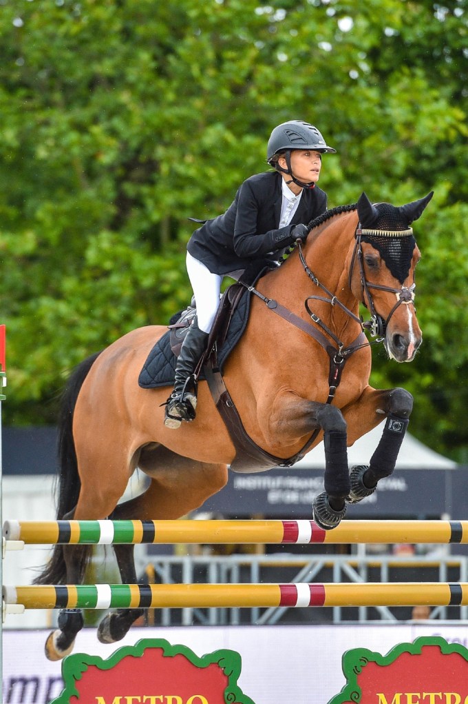 Mary-Kate Olsen competes in horse jumping