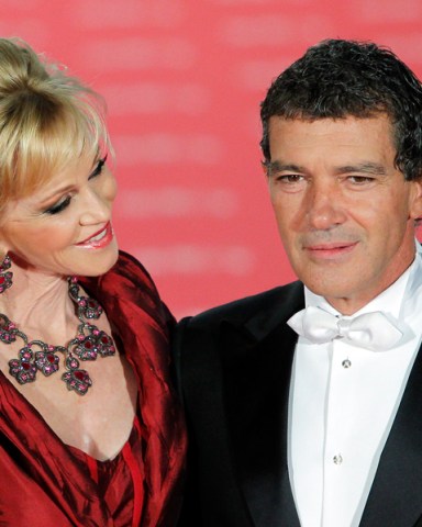 Spanish actor Antonio Banderas, right,  and US actress Melanie Griffith, left, pose on arrival for the "Goya" Film awards ceremony  in Madrid, Spain, Sunday, Feb. 19, 2012. (AP Photo/Andres Kudacki)