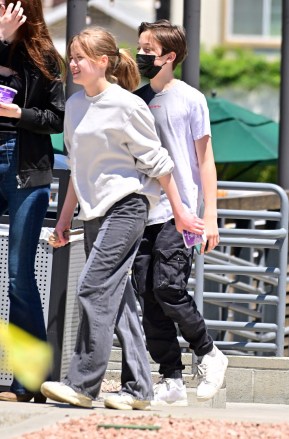 EXCLUSIVE: Vivienne and Knox Jolie-Pitt step out for frozen yogurt with a friend in Los Angeles. 12 May 2022 Pictured: Vivienne Jolie-Pitt and Knox Jolie-Pitt. Photo credit: MEGA TheMegaAgency.com +1 888 505 6342 (Mega Agency TagID: MEGA857144_008.jpg) [Photo via Mega Agency]