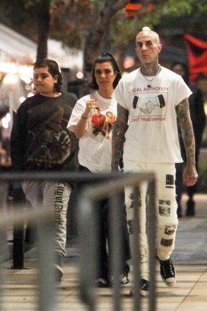 *EXCLUSIVE* Los Angeles, CA  - Kourtney Kardashian and Travis Barker have dinner with Mason at Katsu-ya in Los Angeles, CA. Kourtney was wearing pajamas and a Blink 182 band t-shirt. Shot on 02/07/22.Pictured: Kourtney Kardashian, Travis BarkerBACKGRID USA 8 FEBRUARY 2022 USA: +1 310 798 9111 / usasales@backgrid.comUK: +44 208 344 2007 / uksales@backgrid.com*UK Clients - Pictures Containing ChildrenPlease Pixelate Face Prior To Publication*