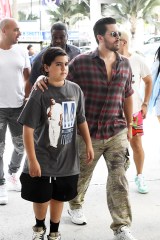 EXCLUSIVE: Scott Disick spends Halloween with his son Mason checking out boats at the Ft. Lauderdale International Boat Show in Florida. 31 Oct 2021 Pictured: Scott Disick; Mason Disick. Photo credit: MEGA TheMegaAgency.com +1 888 505 6342 (Mega Agency TagID: MEGA801132_018.jpg) [Photo via Mega Agency]