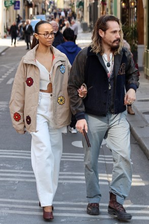 Paris, FRANCE  - *EXCLUSIVE*  - Zoe Saldana and her man, Marco Perego, were caught getting cozy during their recent visit to LLe Saint Louis in Paris. The loved-up duo decided to leave their kids with their grandparents and take a romantic walk around the island, holding hands and smooching along the way.Pictured: Zoe Saldana, Marco PeregoBACKGRID USA 9 APRIL 2023 USA: +1 310 798 9111 / usasales@backgrid.comUK: +44 208 344 2007 / uksales@backgrid.com*UK Clients - Pictures Containing ChildrenPlease Pixelate Face Prior To Publication*