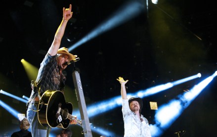 Jason Aldean and Travis Tritt perform during the CMA Fest at LP Field on Friday, June 6, 2014, in Nashville, Tenn. (Photo by Wade Payne/Invision/AP)