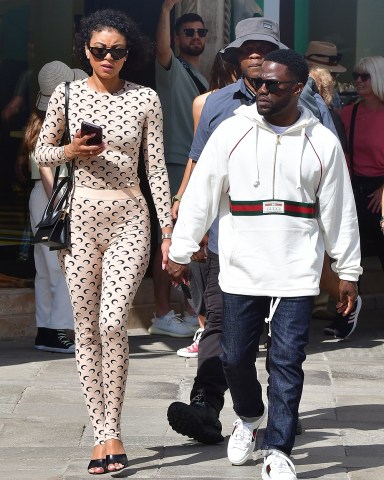 Venice, ITALY  - *EXCLUSIVE*  - Actor and comedian Kevin Hart take a well-earned break from his filming duties with his new movie 'Lift' as he enjoys a stroll and a bite to eat through the city of Venice with his wife Eniko Hart.  Pictured: Kevin Hart, Eniko Hart  BACKGRID USA 13 MAY 2022   BYLINE MUST READ: Cobra Team / BACKGRID  USA: +1 310 798 9111 / usasales@backgrid.com  UK: +44 208 344 2007 / uksales@backgrid.com  *UK Clients - Pictures Containing Children Please Pixelate Face Prior To Publication*