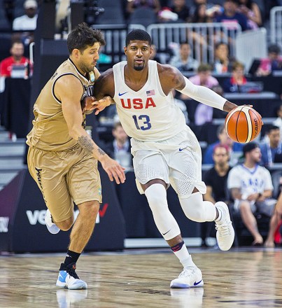 United States forward/center Paul George (13) controls the ball over Argentina forward Luis Scola (4) during the first half of their warm-up international exhibition game , in Las VegasArgentina v USA international friendly basketball game, Las Vegas, USA - 22 Jul 2016The USA defeated Argentina 111-74