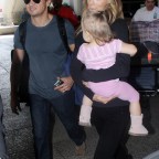 EXC JEREMY RENNER AND FAMILY ARRIVING AT LAX