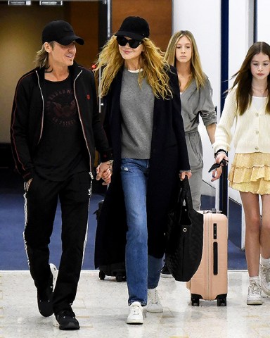 Sydney, AUSTRALIA  - *EXCLUSIVE*  - Nicole Kidman, along with two of her children, Sunday Rose and Faith Margaret, jet into her hometown from Los Angeles early Sunday ahead of Christmas. The Hollywood superstar was spotted arriving at Sydney International Airport the morning after husband Keith Urban played the final show of his “SPEED OF NOW WORLD TOUR 2022” in Melbourne. Keith was there to meet the family.Pictured: Nicole Kidman, Keith UrbanBACKGRID USA 18 DECEMBER 2022 BYLINE MUST READ: Chris Dyson / BACKGRIDUSA: +1 310 798 9111 / usasales@backgrid.comUK: +44 208 344 2007 / uksales@backgrid.com*UK Clients - Pictures Containing ChildrenPlease Pixelate Face Prior To Publication*