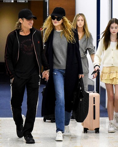 Sydney, AUSTRALIA  - *EXCLUSIVE*  - Nicole Kidman, along with two of her children, Sunday Rose and Faith Margaret, jet into her hometown from Los Angeles early Sunday ahead of Christmas. The Hollywood superstar was spotted arriving at Sydney International Airport the morning after husband Keith Urban played the final show of his “SPEED OF NOW WORLD TOUR 2022” in Melbourne. Keith was there to meet the family.

Pictured: Nicole Kidman, Keith Urban

BACKGRID USA 18 DECEMBER 2022 

BYLINE MUST READ: Chris Dyson / BACKGRID

USA: +1 310 798 9111 / usasales@backgrid.com

UK: +44 208 344 2007 / uksales@backgrid.com

*UK Clients - Pictures Containing Children
Please Pixelate Face Prior To Publication*