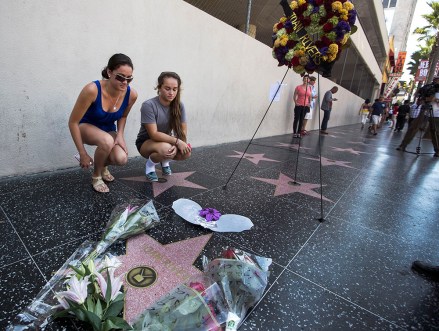 Keely Hassett, Leimana Hassett Joan Rivers star Hollywood Sisters Keely Hassett, left, and Leimana Hassett from Maui, Hawaii, pay their respects next to flowers surrounding Joan Rivers' star and memorial wreath on the Hollywood Walk of Fame in Los Angeles, . Rivers, the raucous, acid-tongued comedian who crashed the male-dominated realm of late-night talk shows and turned Hollywood red carpets into danger zones for badly dressed celebrities, died Thursday. She was 81
Obit-Joan Rivers, Los Angeles, USA