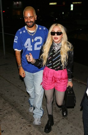 Los Angeles, CA  - *EXCLUSIVE*  - Madonna looks stylish in pink shorts and a Balenciaga top as she enjoys a night out at The Nice guy with a mystery man.Pictured: MadonnaBACKGRID USA 12 JUNE 2022 USA: +1 310 798 9111 / usasales@backgrid.comUK: +44 208 344 2007 / uksales@backgrid.com*UK Clients - Pictures Containing ChildrenPlease Pixelate Face Prior To Publication*
