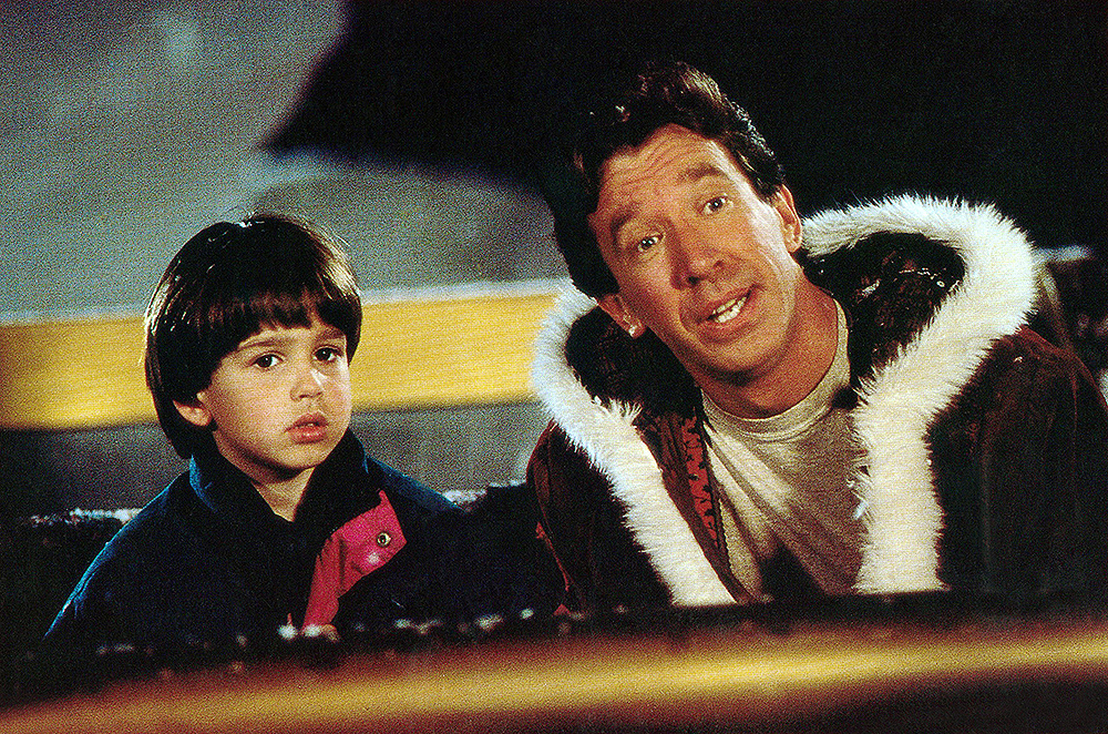 THE SANTA CLAUSE, from left: Eric Lloyd, Tim Allen, 1994, ? Buena Vista/courtesy Everett Collection