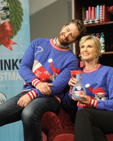 Here is Jane Lynch, 55, cozying up with a pug dog and her Glee costar Matthew Morrison, 37. The actors were both involved with '12 Stinks of Christmas' campaign from air freshener brand Febreze. "When the turkey's burning and your bathroom is seeing a lot of foot traffic from party guests, it hits you: the holidays stink," said the The 40-Year-Old Virgin star. Morrison, who also performs on Broadway, has also collaborated with his former TV co-star for a jolly holiday duet: "We always have such an amazing time together," he said. Pictured: Jane Lynch gets festive with Matthew Morrison and Doug the Pug dog.,Jane Lynch gets festive with Matthew MorrisonDoug the Pug dog.Ref: SPL1193030 101215 NON-EXCLUSIVEPicture by: SplashNews.comSplash News and PicturesLos Angeles: 310-821-2666New York: 212-619-2666London: +44 (0)20 7644 7656Berlin: +49 175 3764 166photodesk@splashnews.comWorld Rights