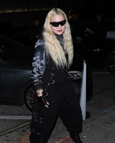 West Hollywood, CA  - *EXCLUSIVE*  - Dressed in all black, a fashionable Madonna heads to Craig's restaurant for a late dinner looking very fresh faced with a male friend in West Hollywood. The 63 year old singer is wearing dined at the American restaurant for 2 hours.  Pictured: Madonna  BACKGRID USA 18 MARCH 2022   USA: +1 310 798 9111 / usasales@backgrid.com  UK: +44 208 344 2007 / uksales@backgrid.com  *UK Clients - Pictures Containing Children Please Pixelate Face Prior To Publication*