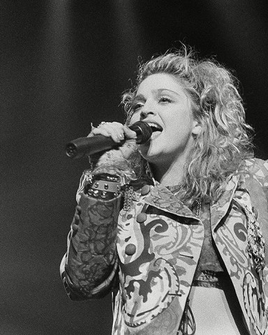 Madonna Rock star Madonna sings as she opened her first national tour at night on in Seattle. She is known for her million-seller records and movie "Desperately Seeking Susan
Madonna Pop Rock Singer, Seattle, USA