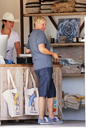 Montecito, CA - *EXCLUSIVE* - Ellen DeGeneres and a friend spent hours scouring upscale garden boutique 'The Well' to decorate her expansive property portfolio.  The retired talkshow host spent almost two hours making furniture orders and was seen carrying a book on English Sculptor Henry Moore and a vintage wooden box to her de ella limited edition Porsche 911 Targa.  Pictured: Ellen DeGeneres BACKGRID USA 4 AUGUST 2021 USA: +1 310 798 9111 / usasales@backgrid.com UK: +44 208 344 2007 / uksales@backgrid.com *UK Clients - Pictures Containing Children Please Pixelate Face Prior To Publication*