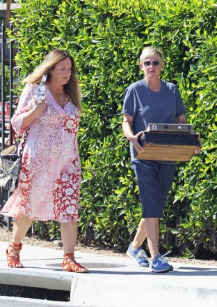 Montecito, CA - *EXCLUSIVE* - Ellen DeGeneres and a friend spent hours scouring upscale garden boutique 'The Well' to decorate her expansive property portfolio.  The retired talkhow host spent almost two hours making furniture orders and was seen carrying a book on English Sculptor Henry Moore and a vintage wooden box to her limited edition Porsche 911 Targa.  Pictured: Ellen DeGeneres BACKGRID USA 4 AUGUST 2021 USA: +1 310 798 9111 / usasales@backgrid.com UK: +44 208 344 2007 / uksales@backgrid.com *UK Clients - Pictures Containing Children Please Pixelate Face Prior To Publication*