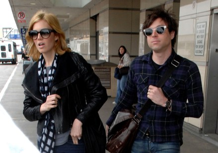 Mandy Moore and new husband Ryan Adams embrace married life together and joke around as they got of their flight in Los Angeles.  Laughing and smiling at each other, the couple walked to an awaiting limousine at LAX.  The rocker couple both wore tight jeans, shoulder bags, and sunglasses.Pictured: Mandy Moore and Ryan Adams,Mandy MooreRyan AdamsRef: SPL88521 210309 NON-EXCLUSIVEPicture by: SplashNews.comSplash News and PicturesLos Angeles: 310-821-2666New York: 212-619-2666London: 0207 644 7656Milan: 02 4399 8577photodesk@splashnews.comWorld Rights