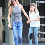 EXCLUSIVE: Newly single Gisele Bundchen looks happy as she takes her daughter Vivian to a riding lesson in Miami
