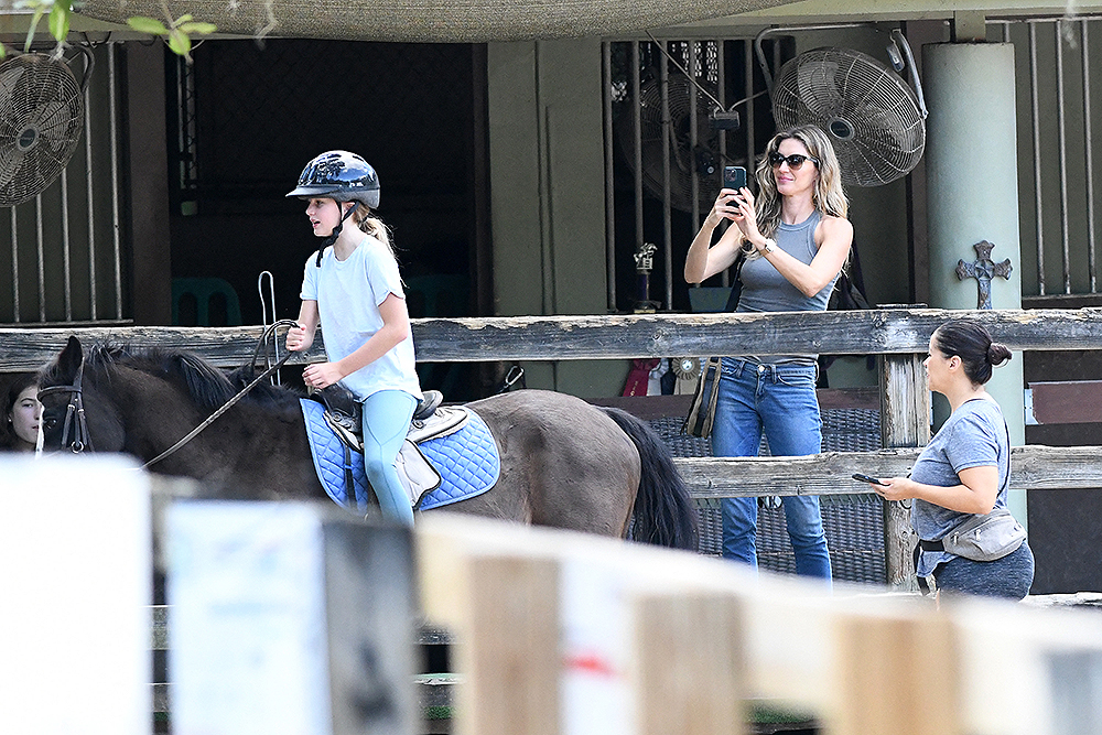 EXCLUSIVE: Newly single Gisele Bundchen looks happy as she takes her daughter Vivian to a riding lesson in Miami