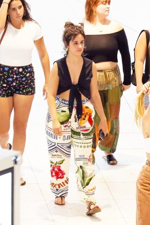 Miami Beach, FL  - *EXCLUSIVE*  - Camila Cabello, who just turned 26 a week ago, is seen surrounded by her best friends walking, shopping and having lunch at Aventura Mall. The singer keeps it casual in white FARM Rio printed pants and a black top for the outing.Pictured:  Camila CabelloBACKGRID USA 8 MARCH 2023 USA: +1 310 798 9111 / usasales@backgrid.comUK: +44 208 344 2007 / uksales@backgrid.com*UK Clients - Pictures Containing ChildrenPlease Pixelate Face Prior To Publication*