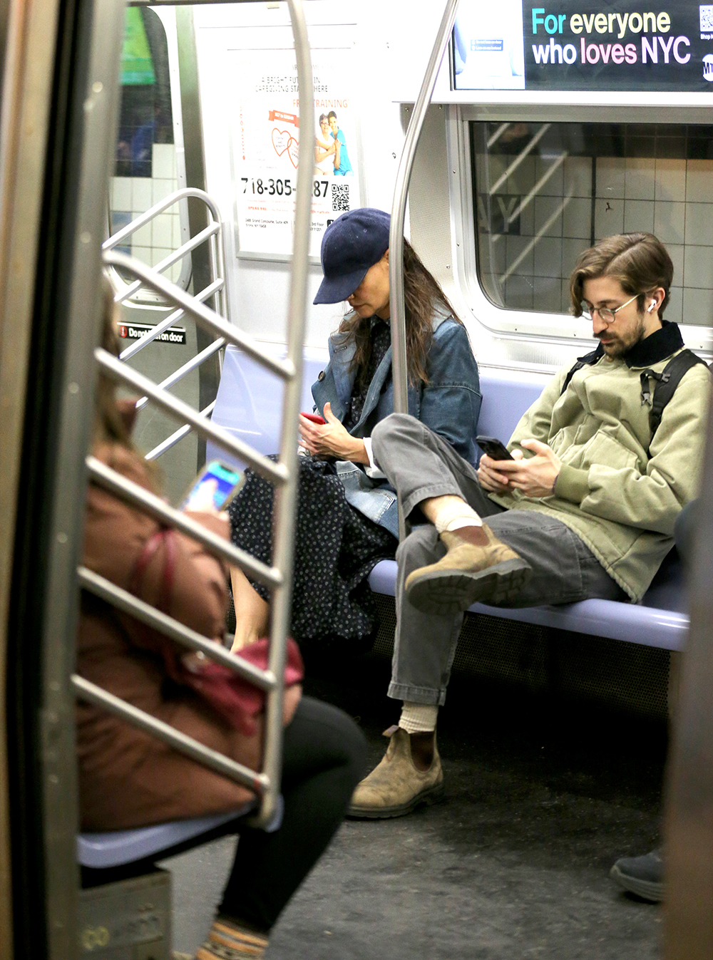 Katie Holmes Checks Her Phone While Riding Incognito On The F Train To Her Matinee Performance Of 'The Wanderers' In New York City