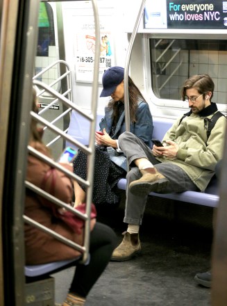 Katie Holmes checks her phone while riding incognito on the F train to her matinee performance of 'The Wanderers' in New York CityPictured: Katie HolmesRef: SPL5531357 190323 NON-EXCLUSIVEPicture by: Christopher Peterson / SplashNews.comSplash News and PicturesUSA: +1 310-525-5808London: +44 (0)20 8126 1009Berlin: +49 175 3764 166photodesk@splashnews.comWorld Rights