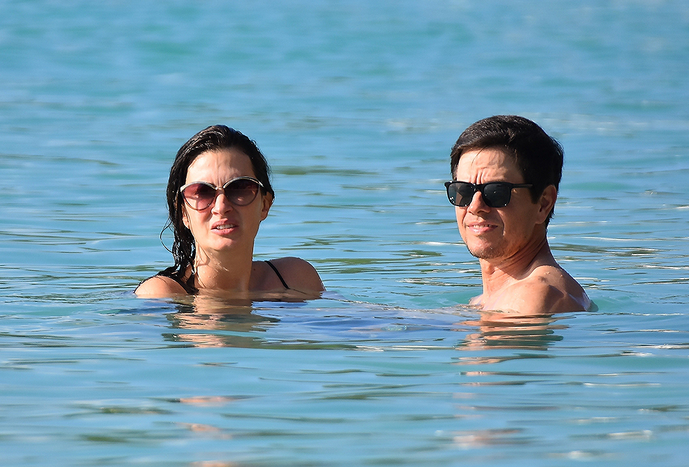 *EXCLUSIVE*  Mark Wahlberg sports a BAD sunburn on his arms while out enjoying a day at the beach in Barbados!