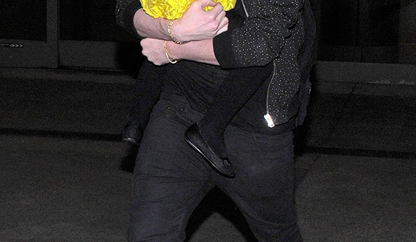 Brooklyn Beckham Carrying Harper Beckham