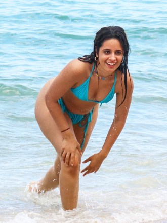 Coral Gables, FL - * EXCLUSIVE * - Camila Cabello can't stop laughing during a fun day out on the beach with her besties in Miami on Monday.  The superstar singer who was rencetly spotted enjoying a tip to Italy sported a cheeky blue two piece and a huge smile throughout.  Pictured: Camila Cabello BACKGRID USA 15 JUNE 2022 BYLINE MUST READ: BACKGRID USA: +1 310 798 9111 / usasales@backgrid.com UK: +44 208 344 2007 / uksales@backgrid.com * UK Clients - Pictures Containing Children Please Pixelate Face Prior To Publication *