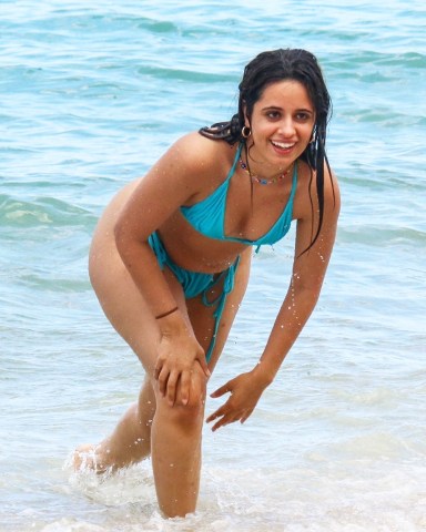 Coral Gables, FL  - *EXCLUSIVE*  - Camila Cabello can’t stop laughing during a fun day out on the beach with her besties in Miami on Monday. The superstar singer who was rencetly spotted enjoying a tip to Italy sported a cheeky blue two piece and a huge smile throughout.  Pictured: Camila Cabello  BACKGRID USA 15 JUNE 2022   BYLINE MUST READ: BACKGRID  USA: +1 310 798 9111 / usasales@backgrid.com  UK: +44 208 344 2007 / uksales@backgrid.com  *UK Clients - Pictures Containing Children Please Pixelate Face Prior To Publication*