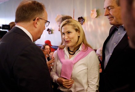 Heidi Cruz, wife of Republican presidential candidate, Sen. Ted Cruz, R-Texas, talks with supporters during a campaign stop at Lincoln Square Pancake House, Tuesday, May 3, 2016, in Westfield, Ind. (AP Photo/Darron Cummings)