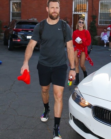 Los Angeles, CA  - *EXCLUSIVE*  - Julianne Hough and Brooks Laich pictured outside Pico Union Project in Downtown L.A after hosting “Daybreaker L.A” workout class.  Julianne was all smiles still wearing a red sweatshirt, floral wrap dance skirt which showed off her toned legs and no ring. The couple has been reportedly been on the rocks for the past few months but neither has publicly addressed any marital trouble.  Pictured: Julianne Hough, Brooks Laich  BACKGRID USA 5 MARCH 2020   BYLINE MUST READ: BACKGRID  USA: +1 310 798 9111 / usasales@backgrid.com  UK: +44 208 344 2007 / uksales@backgrid.com  *UK Clients - Pictures Containing Children Please Pixelate Face Prior To Publication*