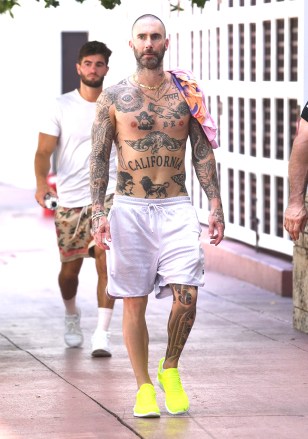 A shirtless Adam Levine is seen leaving Anataomy Gym in Miami Beach, showing off his array of tattoos and muscular physique.  Pictured: Adam Levine Ref: SPL5236209 030721 NON-EXCLUSIVE Picture by: Garguibo / SplashNews.com Splash News and Pictures USA: +1 310-525-5808 London: +44 (0)20 8126 1009 Berlin: +49 175 3764 166 photodesk @splashnews.com World Rights