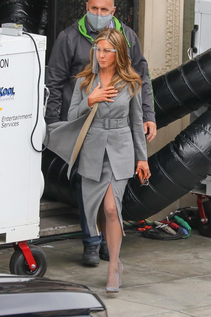 Jennifer Aniston in a grey power suit