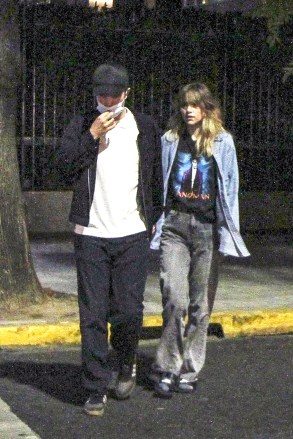 Argentina, ARGENTINA  - *EXCLUSIVE*  - Robert Pattinson went to dinner incognito with his girlfriend Suki Waterhouse and their local friend and hostess. The actor had arrived in the city 3 days ago to wait for his partner who appeared on Friday at the Lollapalooza festival. Both he and her friend accompanied her and were behind the scenes when the model, singer and actress gave her show at the Lollapalooza Festival. There, when she finished, she thanked the Argentine public and said "it was the best show of my life. I will never forget it, I love you”. Later, back in the Palermo neighborhood, they decided to go to dinner together, where they walked hand in hand. They chose to try typical local dishes and went to a neighborhood tavern. They tried not to be recognized (he never took off his cap, not even inside the restaurant). However, it was not enough to go unnoticed in front of the other diners who got up to ask him for a photo. They refused, saying that they were resting and enjoying themselves and that they did not want to be disturbed. They they got up and returned to the apartment where they are staying until she leaves for Chile ton Saturday where she will appear in the Lollapalooza edition in that country.Pictured: Robert Pattinson, Suki WaterhouseBACKGRID USA 18 MARCH 2023 BYLINE MUST READ: The Grosby Group / BACKGRIDUSA: +1 310 798 9111 / usasales@backgrid.comUK: +44 208 344 2007 / uksales@backgrid.com*UK Clients - Pictures Containing ChildrenPlease Pixelate Face Prior To Publication*