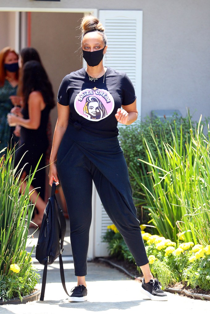 Tyra Banks looks casual for the Day of Indulgence party