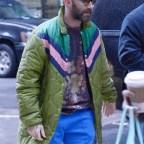 Adam Levine Wears A Colorful Green Jacket Coat, Blue Pants And Nike Sneakers At The NBC Upfronts In NYC
