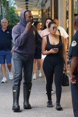 *PREMIUM-EXCLUSIVE* Miami, FL - Kanye West is treating his new GF Chaney James to some food and shopping at Miami's Bal Harbour. We caught Kanye taking a phone call while walking alongside his new beau. The rapper wore a Boston Fire Dept. hoodie and spent most of his time shopping at Balenciaga where he was seen buying up goods from his favorite designer for Jones. Kanye had similarly showered recent ex Julia Fox with pricey designer gifts as well.Pictured: Kanye West, Chaney JonesBACKGRID USA 24 FEBRUARY 2022 USA: +1 310 798 9111 / usasales@backgrid.comUK: +44 208 344 2007 / uksales@backgrid.com*UK Clients - Pictures Containing ChildrenPlease Pixelate Face Prior To Publication*
