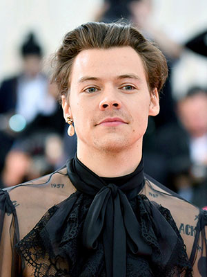 Harry Styles rocks a Beatles-inspired military jacket for retro photoshoot