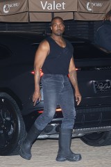 Malibu, CA  - A surprisingly ripped Kanye West is seen steps out to dinner with Kim Kardashian look-a-like Instagram model Chaney Jones at Nobu in Malibu. Kanye didn't shy away from flaunting his more slim muscular physique as he donned a low-cut muscle tank, jeans, and some boots.Pictured: Kanye West, Chaney JonesBACKGRID USA 7 FEBRUARY 2022BYLINE MUST READ: ShotbyNYP / BACKGRIDUSA: +1 310 798 9111 / usasales@backgrid.comUK: +44 208 344 2007 / uksales@backgrid.com*UK Clients - Pictures Containing Children
Please Pixelate Face Prior To Publication*