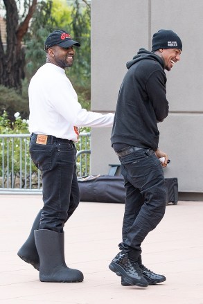 Thousand Oaks, CA - Kanye West is seen laughing and joking with Nick Cannon as the two stars bump into each other at their kid's basketball game at Thousand Oaks.  Image: Kanye West, Nick Cannon Backgrid USA 15 October 2022 USA: +1 310 798 9111 / usasales@backgrid.com UK: +44 208 344 2007 / uksales@backgrid.com * UK Customers - Images with children please pixelate first Publications*